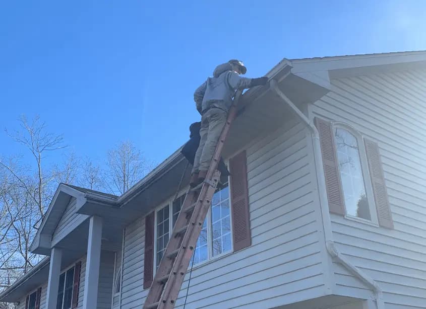 Gutter cleaning and maintenance being performed by Tallmadge Power Washing in Tallmadge