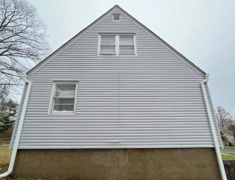 Tallmadge Power Washing technician performing detailed house washing in Tallmadge residential area