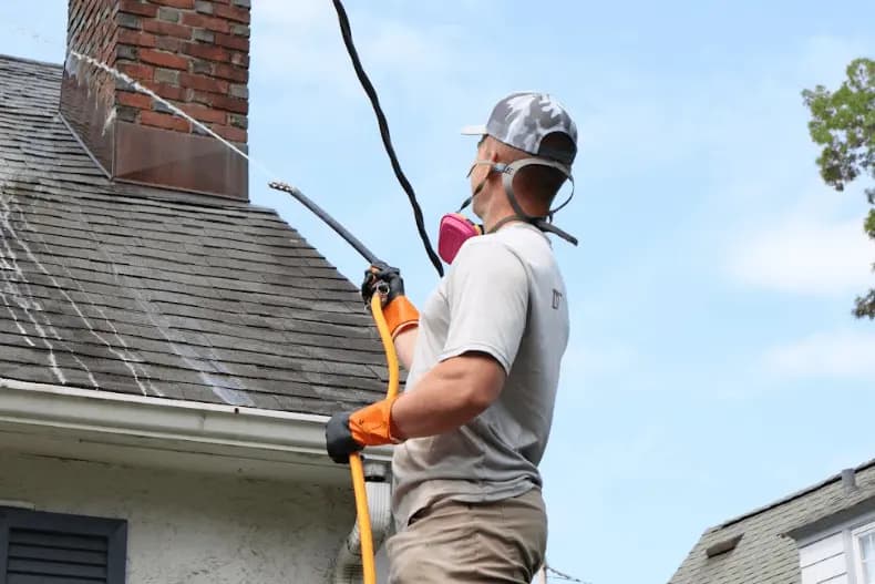 Tallmadge Power Washing professional performing gentle roof washing service in Tallmadge